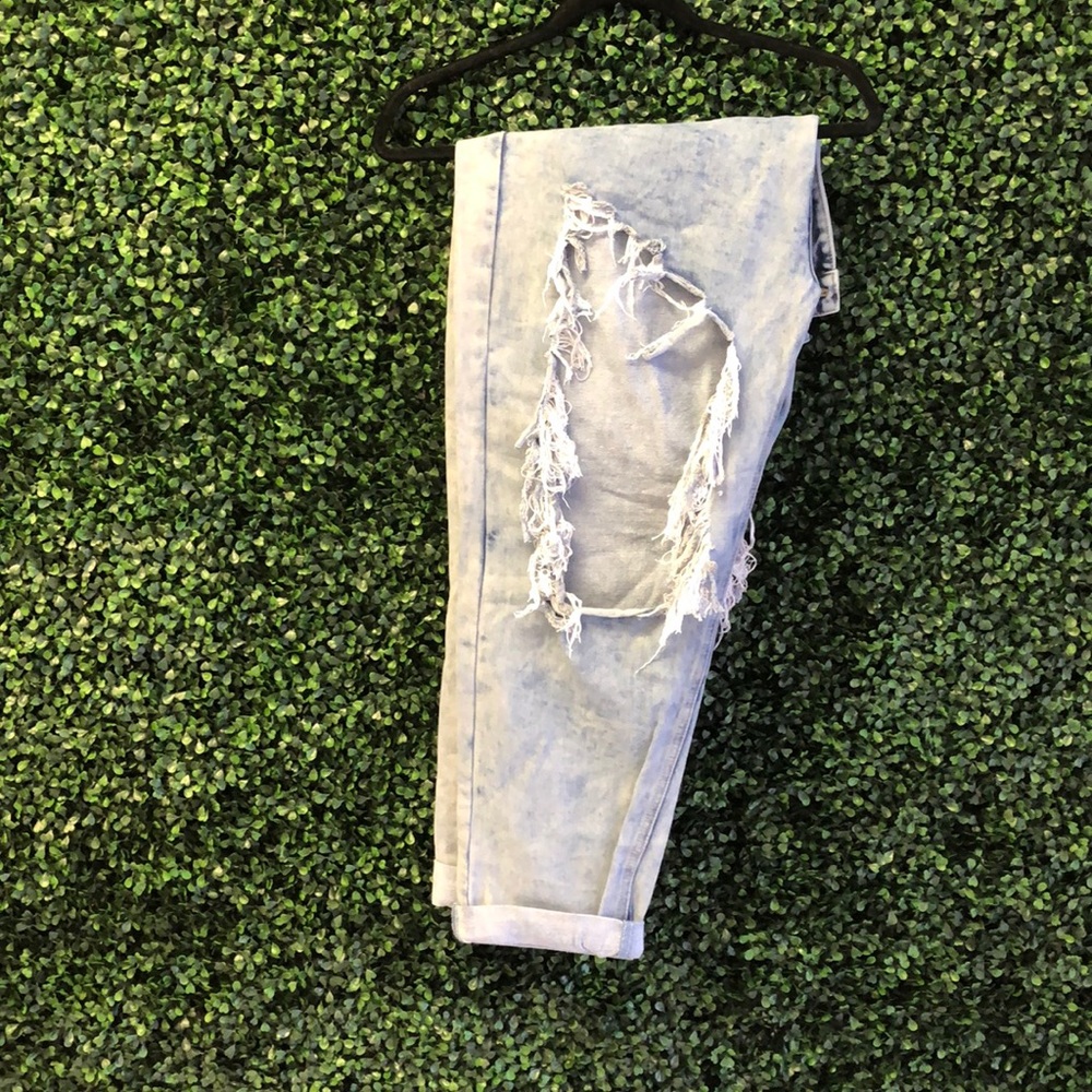 Ripped , angle jeans.